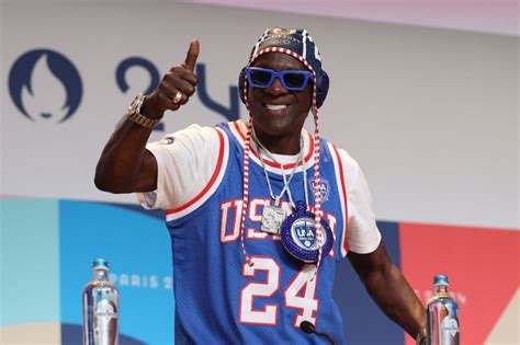 Flavor Flav Unveils Bronze Clock Necklace For Jordan Chiles - WBLS