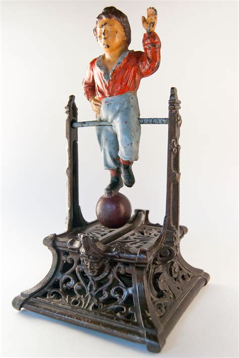 Boy on Trapeze Antique Mechanical Cast Iron Bank