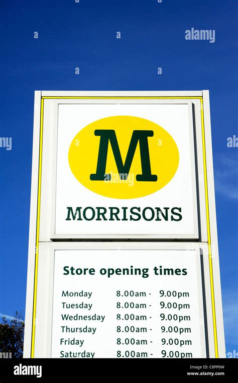 morrisons store opening times sign Stock Photo - Alamy