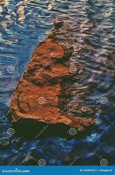 A Beautiful Artistic Picture of a Rock in a Water Stock Image - Image ...