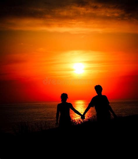 Lovers at sunset stock photo. Image of romanticist, hand - 24736932