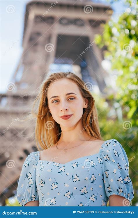 Young Beautiful and Elegant Woman in Blue Dress Near the Eiffel Tower ...