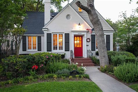 White cottage with shutters and red front door via Zillow | Cottage ...