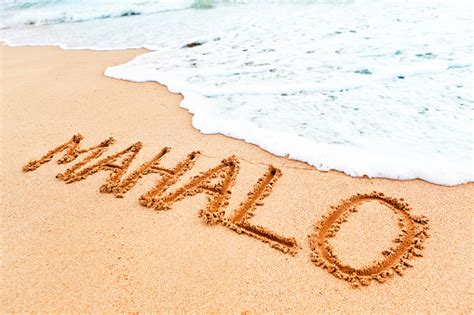 Hawaiian Greeting Mahalo Written On The Sandy Beach Of Hawaii Stock Photo - Download Image Now ...