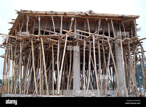 Building under construction. Bamboo framework usage in traditional ...