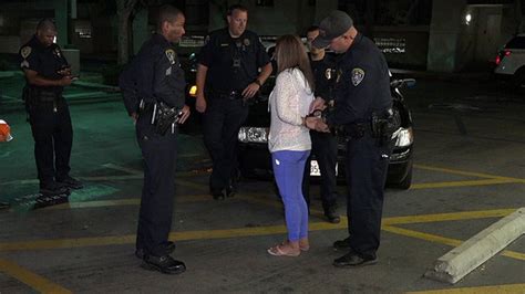 Woman arrested on suspicion of DUI after driving car on trolley tracks