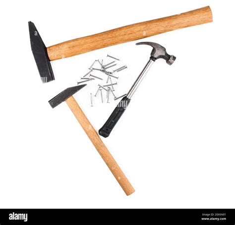 Hammers and metal nails isolated on white Stock Photo - Alamy