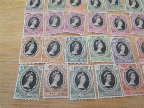 Lot # 105 - 61 British Commonwealth 1953 Coronation Stamps | EstateSales.org