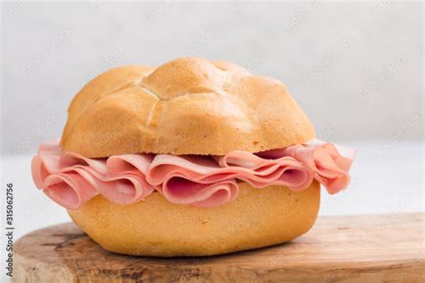 Mortadella sandwich. Mortadella Bologna - a large italian sausage or luncheon with meat. Tipycal ...