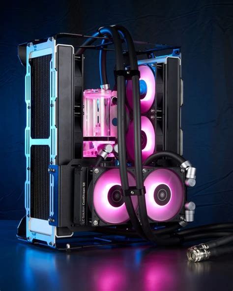 a computer case with pink and blue lights on the side, in front of a black background