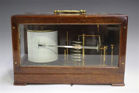 A mid-20th century mahogany cased barograph with lacquered brass ...