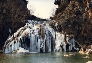 A winter weather creates a frozen beauty at Turner Falls in Davis. | Turner falls, Midwest road ...