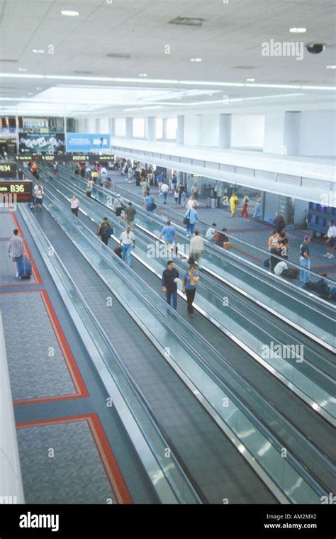 Moving sidewalks in the concourse of a major airport Stock Photo - Alamy