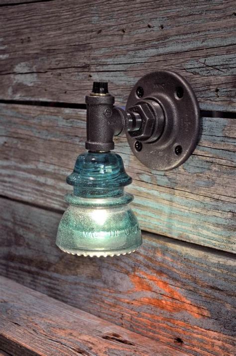 Upcycling ideas with glass insulators – home and garden decorations