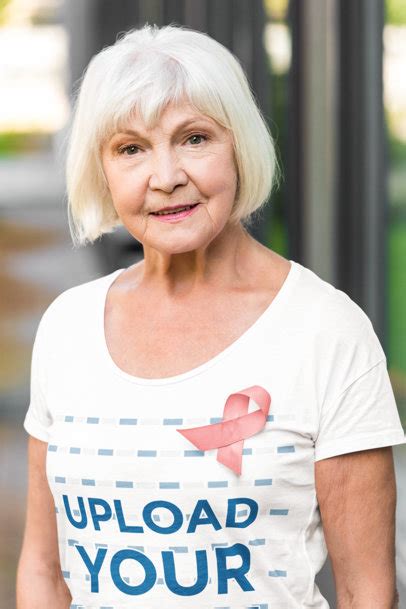 Placeit - T-Shirt Mockup of a Proud Woman Wearing a Breast Cancer Awareness Ribbon