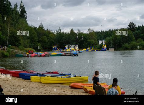 Water activities, including kayaking and a inflatable run at the main lake in Center Parcs ...