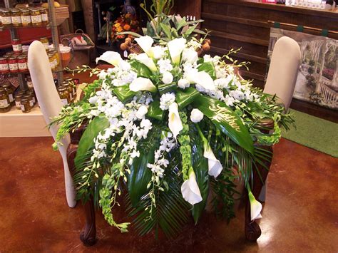 Casket Spray of WHite Calla's Orchids and Roses with Bells of Ireland and mixed Greens. Flowers ...