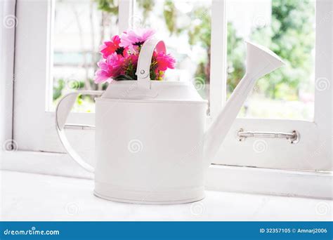 Flowers in watering pot stock image. Image of shop, natural - 32357105