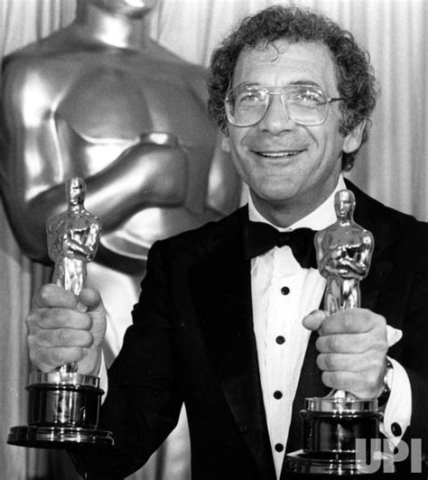 Photo: Sydney Pollack clutches two Oscar statuettes for the movie "Out of Africa ...