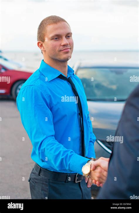 Businessmen shaking hands over a deal Stock Photo - Alamy