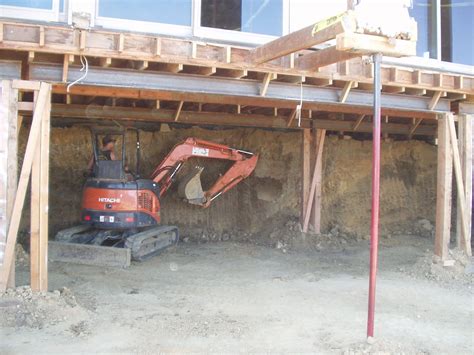 Excavation Underneath House for Underpinning and New Basement | Midwest Foundation Tech, Inc.