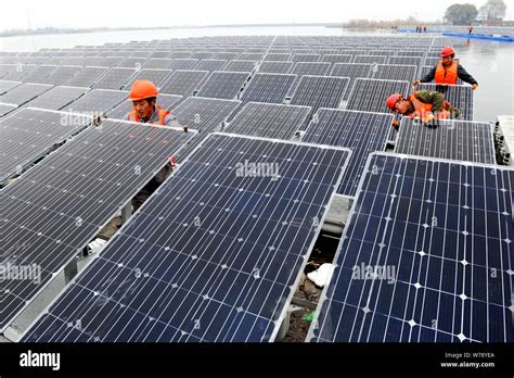 --FILE--Chinese workers install solar panels to generate electricity in Huainan city, east China ...