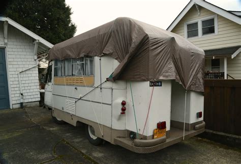 OLD PARKED CARS.: 1976 Commer Camper Van.