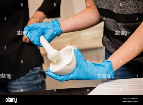 Kids wearing latex gloves for science experiment Stock Photo - Alamy