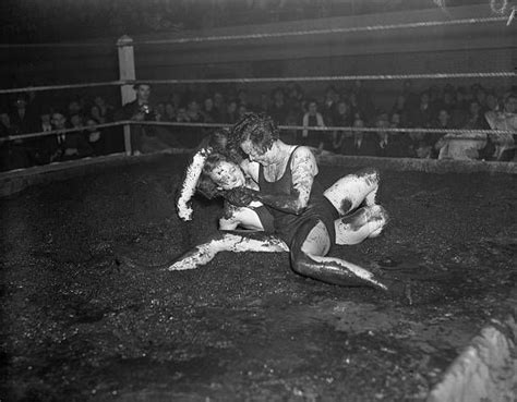 1938: Mildred Burke and Leona Gordon Mud Wrestling (Original Caption) Mildred (Cyclone) Burke ...