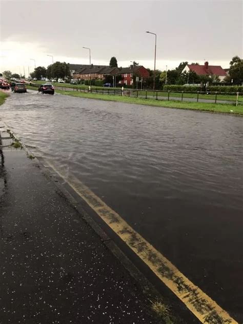 Edinburgh flooding: Watch as cyclist braves deep water, trains are stranded and cars float in ...