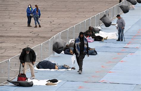 Hundreds of homeless in Las Vegas sleep six feet apart in parking lot ...