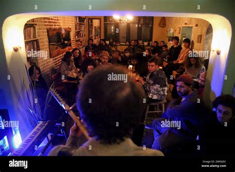 Tehran, Tehran, Iran. 18th Jan, 2023. Iranian young people listen to a ...