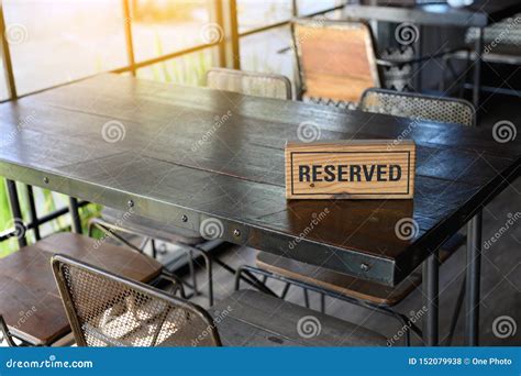 Restaurant Reserved Table Sign Reserved Table. A Tag Of Reservation Placed On The Wood Table ...