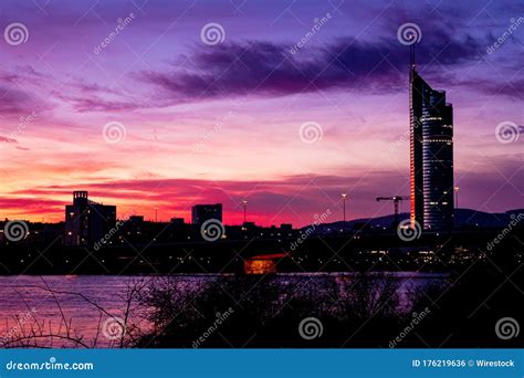 Silhouette of Vienna Skyline at Dusk with the Millennium Tower on the Side Against Colorful Sky ...