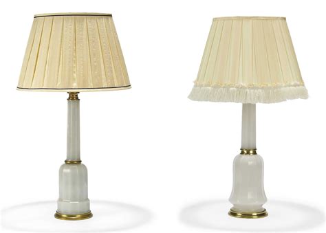 TWO SIMILAR BRASS-MOUNTED WHITE OPALINE FACETED GLASS LAMPS , ONE BY ...