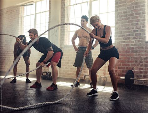 "Young People Doing Intense Workout With Heavy Ropes" by Stocksy ...