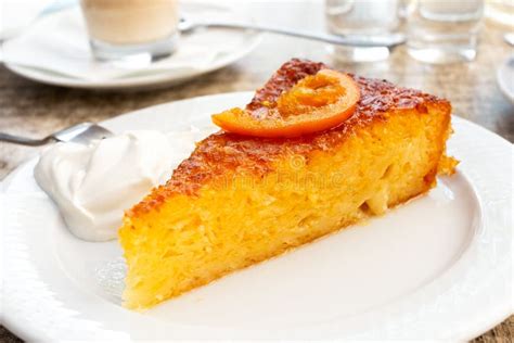 A Piece of Traditional Greek Orange Cake with Sour Cream on Whit Stock Photo - Image of yellow ...