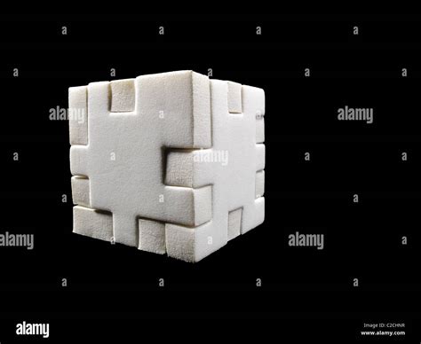 Puzzle cube white on a black background Stock Photo - Alamy