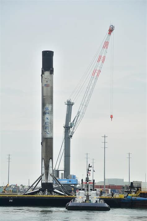 SpaceX Booster, Barge and Crane Photograph by Bradford Martin - Pixels