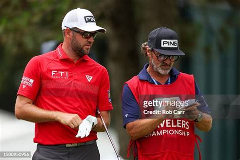 Corey Conners of Canada talks with his caddie Danny Sahl on the fifth ...