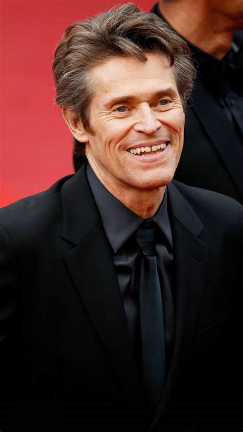 Download Willem Dafoe Bright Smile Wallpaper | Wallpapers.com