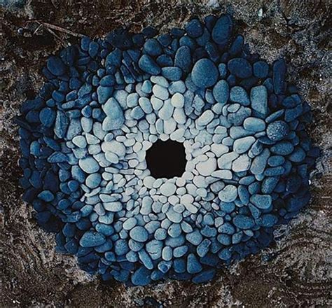 Pebbles around a hole by Andy Goldsworthy on artnet