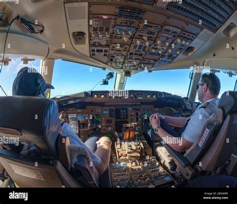 Cockpit view in Boeing 757-200 with pilot and co-pilot Stock Photo - Alamy