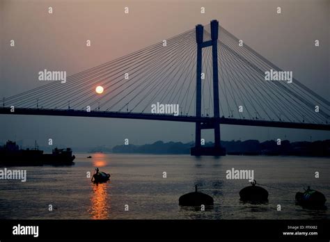 Howrah bridge sunset hi-res stock photography and images - Alamy