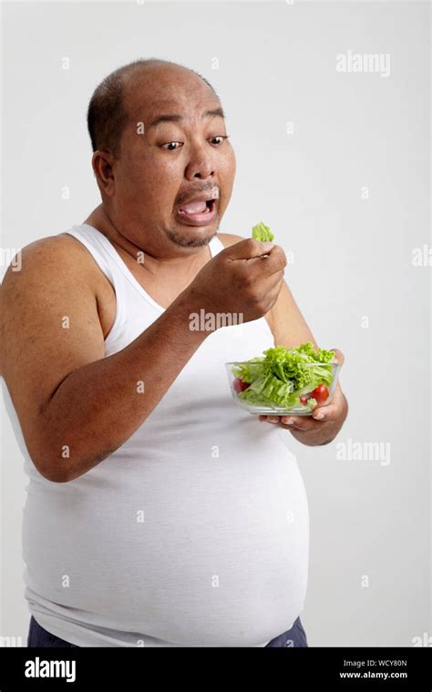 Man eating too much hi-res stock photography and images - Alamy