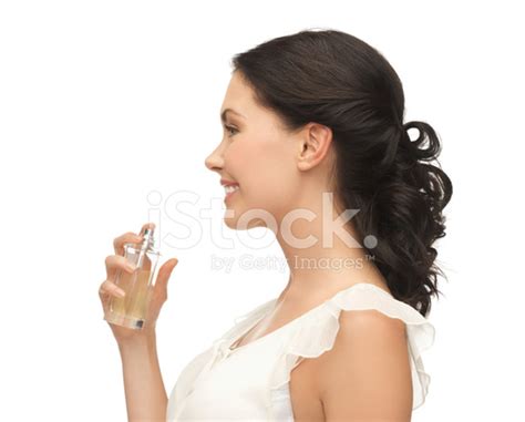 Woman Spraying Perfume On Her Neck Stock Photo | Royalty-Free | FreeImages