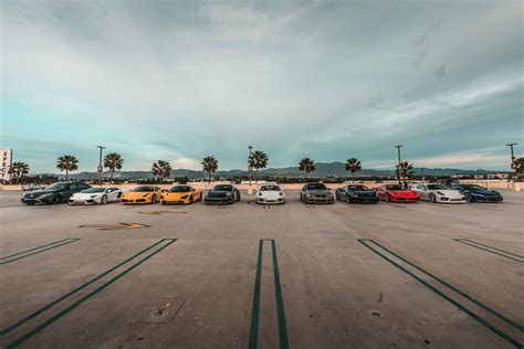 Luxury Cars Parked on Parking Area · Free Stock Photo