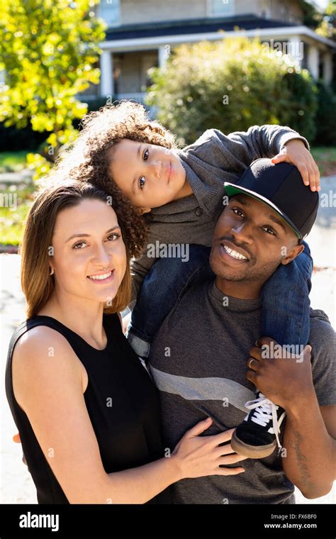 Family smiling outdoors Stock Photo - Alamy