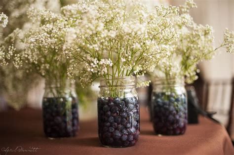 Great idea for table bouquets -- blueberries to hold up the baby's ... | Wedding floral ...