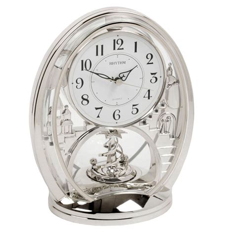 Rhythm Contemporary Modern Mantel Clock Silver Colour Rotating Twist Pendulum | eBay